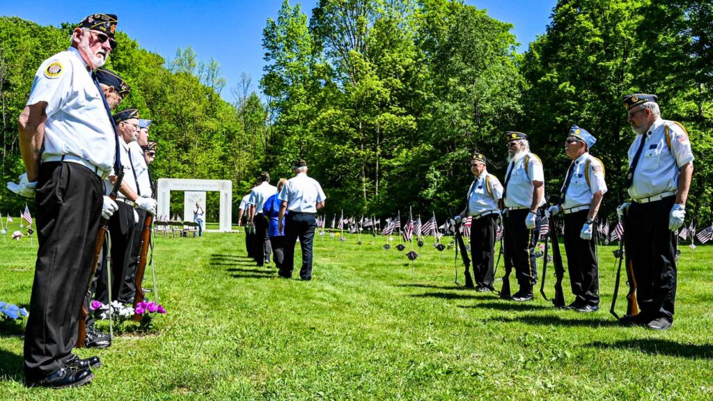Members of the American Legion, Post 108, hold attention while members of the Veterans of Foreign Wars, Post 212, both of Bradford, made their way to the Willow Dale Cemetery memorial to fallen soldiers to hold space for a ceremony to honor their memorial for a Memorial Day Service on Sunday morning.