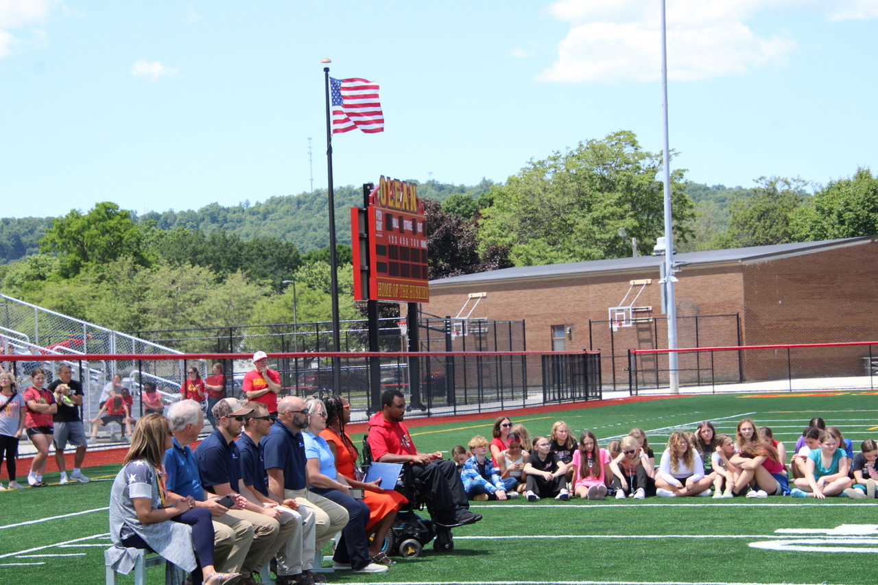 (Rick Miller/Olean Star) Olean school officials cut the ribbon to the new playground outside the Olean Intermediate Middle School on Wayne Street Friday. It was part of the turf field project.