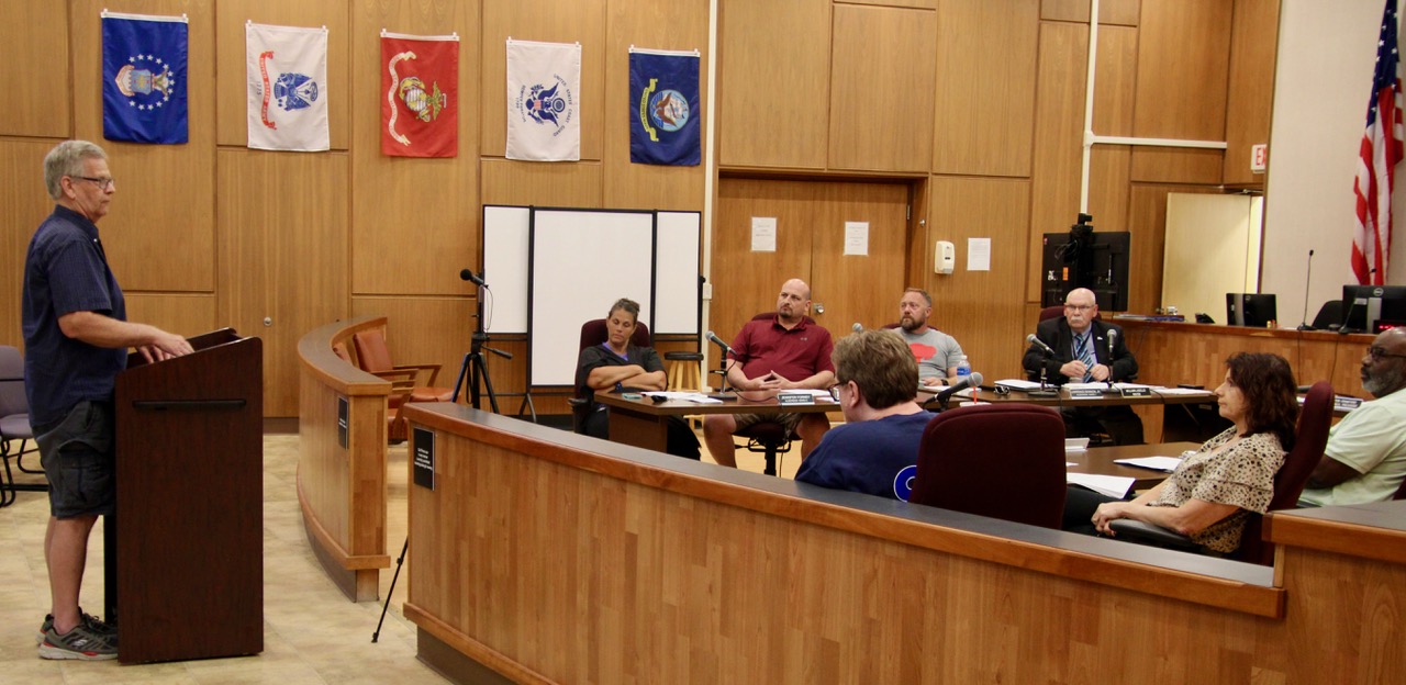 (Rick Miller/Olean Star) Glenn Wahl of Salamanca, (standing at left) urged the Olean Common Council Tuesday to resolve their problem of sewage overflowing into the Allegheny River during heavy rains in months, not years.