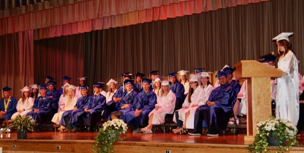 (Rick Miller/Olean Star)  Hinsdale Valedictorian Alexandria Goodyear addresses fellow graduates, family and friends in the audience at Friday night’s commencement ceremony in the school auditorium.