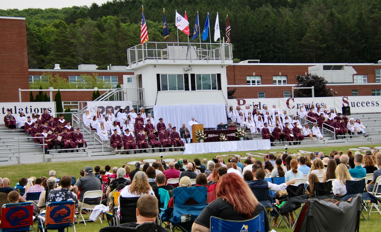 (Rick Miller/Olean Star) Portville Central School Senior Class Vice President Delaney Grandusky addresses fellow graduates, family and school staff and officials Friday night on the football field in front of the school. There were 83 graduates.