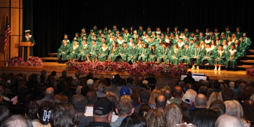 (Rick Miller/Olean Star)  Allegany-Limestone seniors listen to Valedictorian Xavier Hilmey at the school’s 29th commencement Saturday.