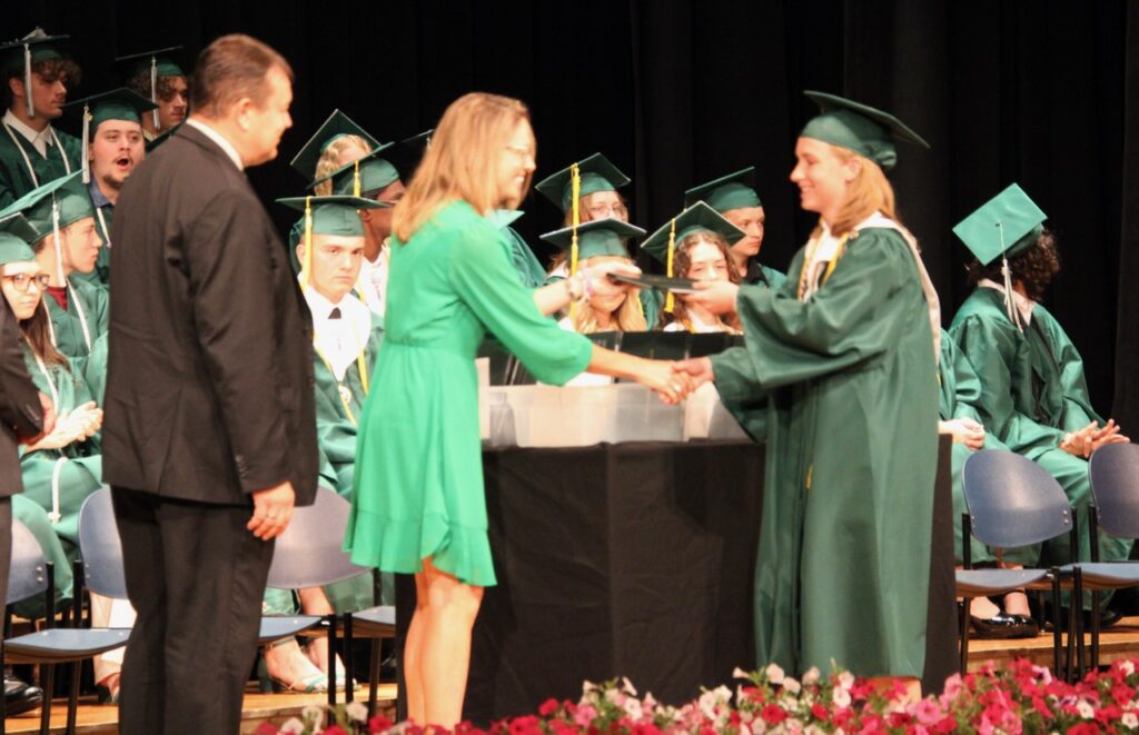 (Rick Miller/Olean Star)  Allegany-Limestone senior Katherine Crawford receives her diploma during commencement ceremonies Saturday. 