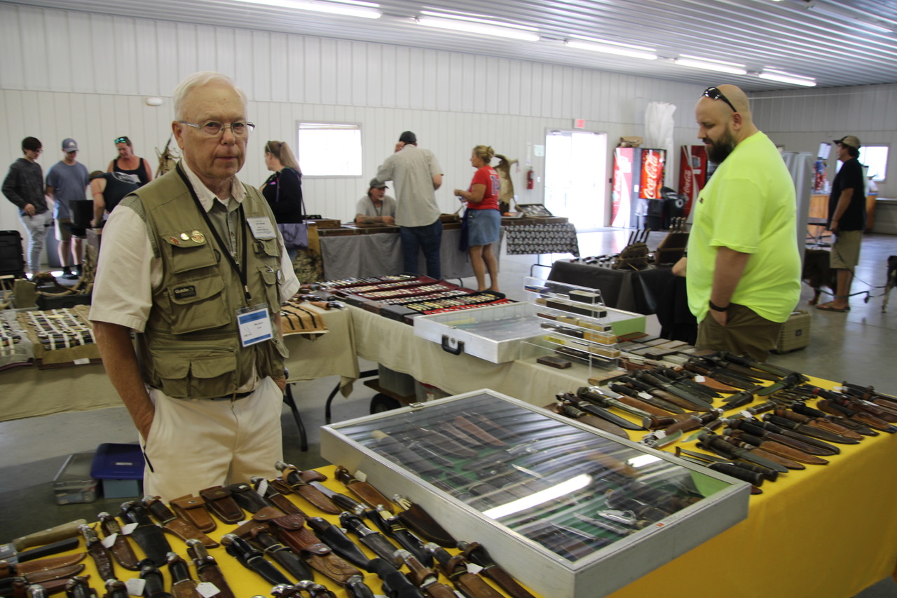 (Rick Miller/Olean Star) Mike Spors, a knife collector from Janesville, WI, buys and sells pocket knives, hunting knives and straight razors. He said attendance was good on opening day of Village of Knives at the Cattaraugus County Fairgrounds in Little Valley.