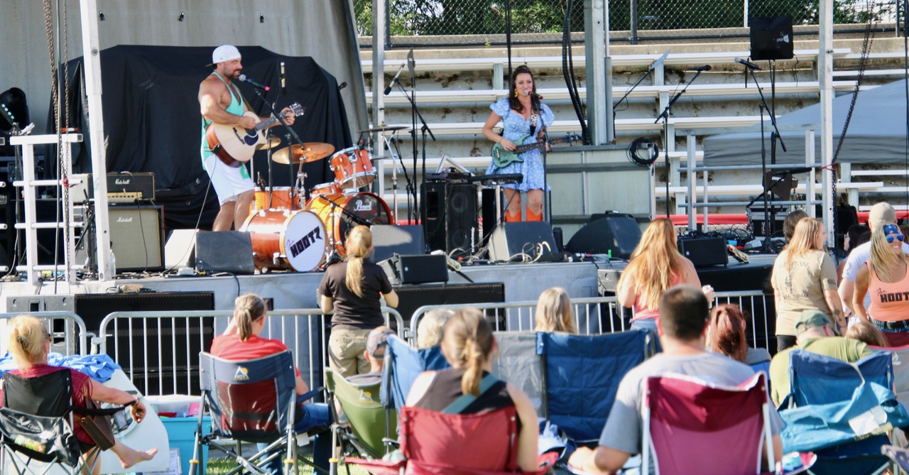 (Rick Miller/Olean Star) The Hoots, Luke and Ange Marino, a country-rock duo from Nashville pitched in at Saturday’s Southern Tier Wounded Warrior concert at Bradner Stadium for Harper Grace, a Dallas native and American Idol alum, who was stranded by the airline computer snafu caused by a Crowdstrike update.