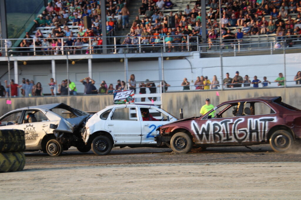 (Rick Miller/Olean Star) Cattaraugs County Fairgoers line the grandstand Monday night for the demolition derby.