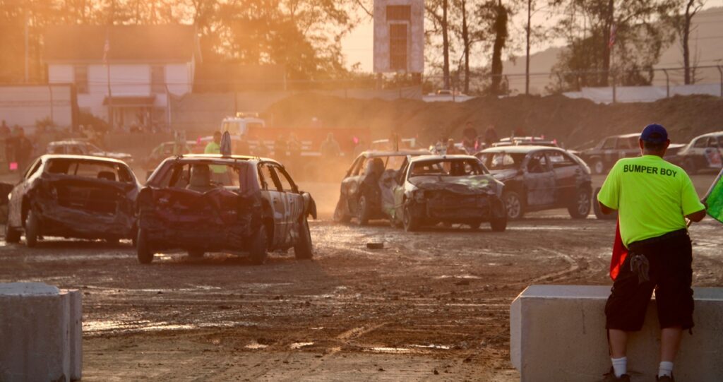 (Rick Miller/Olean Star)
The sun was setting over the Cattaraugus County Fairgrounds as the final heat of the demolition derby got underway Monday.
