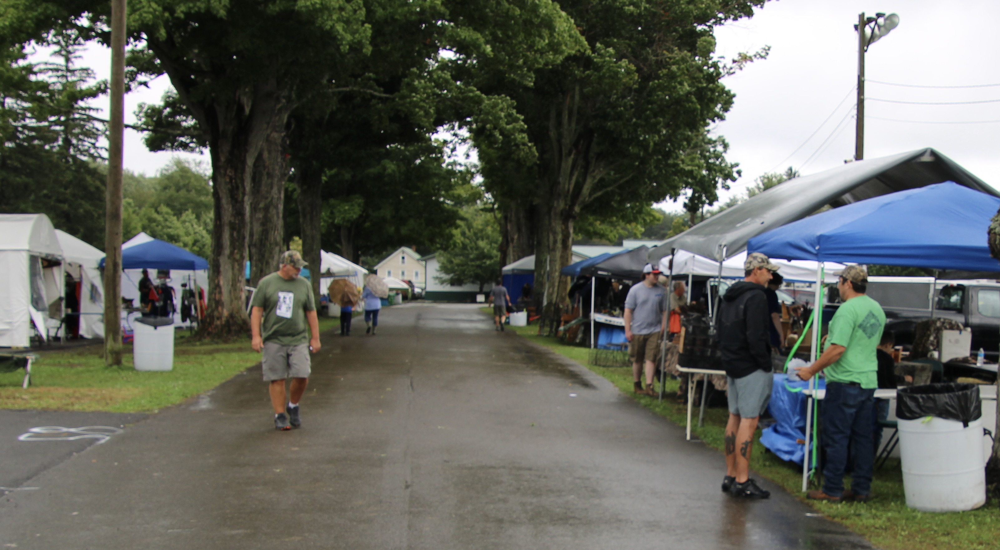 (Rick Miller/Olean Star) Vendor tents line the Cattaraugus County Fairgrounds midway on Friday at the opening day of the annual Sportsmen's Rendezvous.
