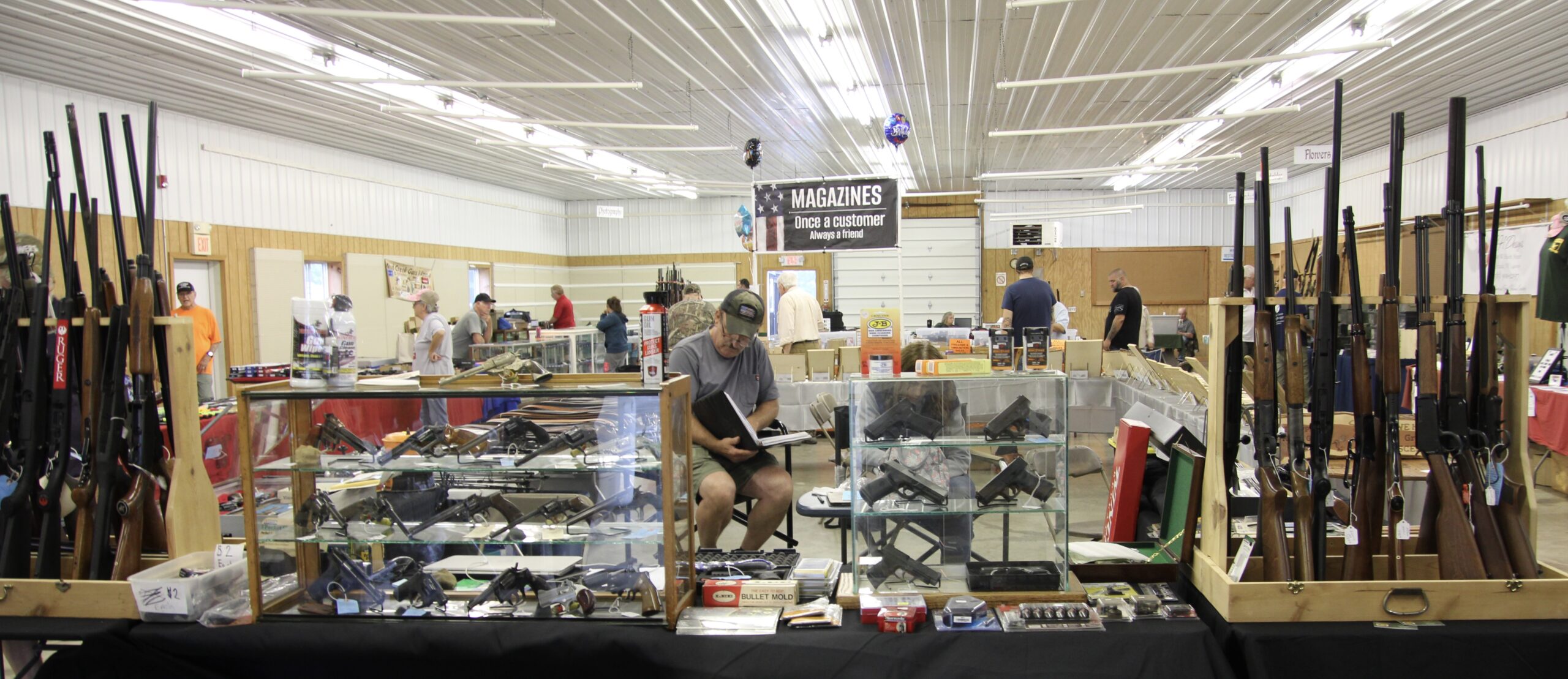 Ricki Miller/Olean Star The Domestic Building at the Cattaraugus County Fairgrounds was full of displays including firearms, fishing equipment lazer-cut images in wood and hunting accessories at the annual Sportsmen's Rendezvous in L:ittle Valley Friday. It is open through Sunday.