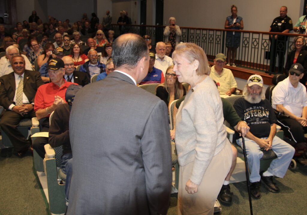 (Rick MIller/Olean Star)
U.S. Rep Nick Langworthy thanks Vietnam-era veteran Jane Boudin of Olean for her service as an Army nurse during a 50th Anniversary Vietnam-era Veterans Pinning Ceremony Wednesday at Cutco Theater on the Cattaraugus County Campus of Jamestown Community College. Seventy-five veterans and their families attended.