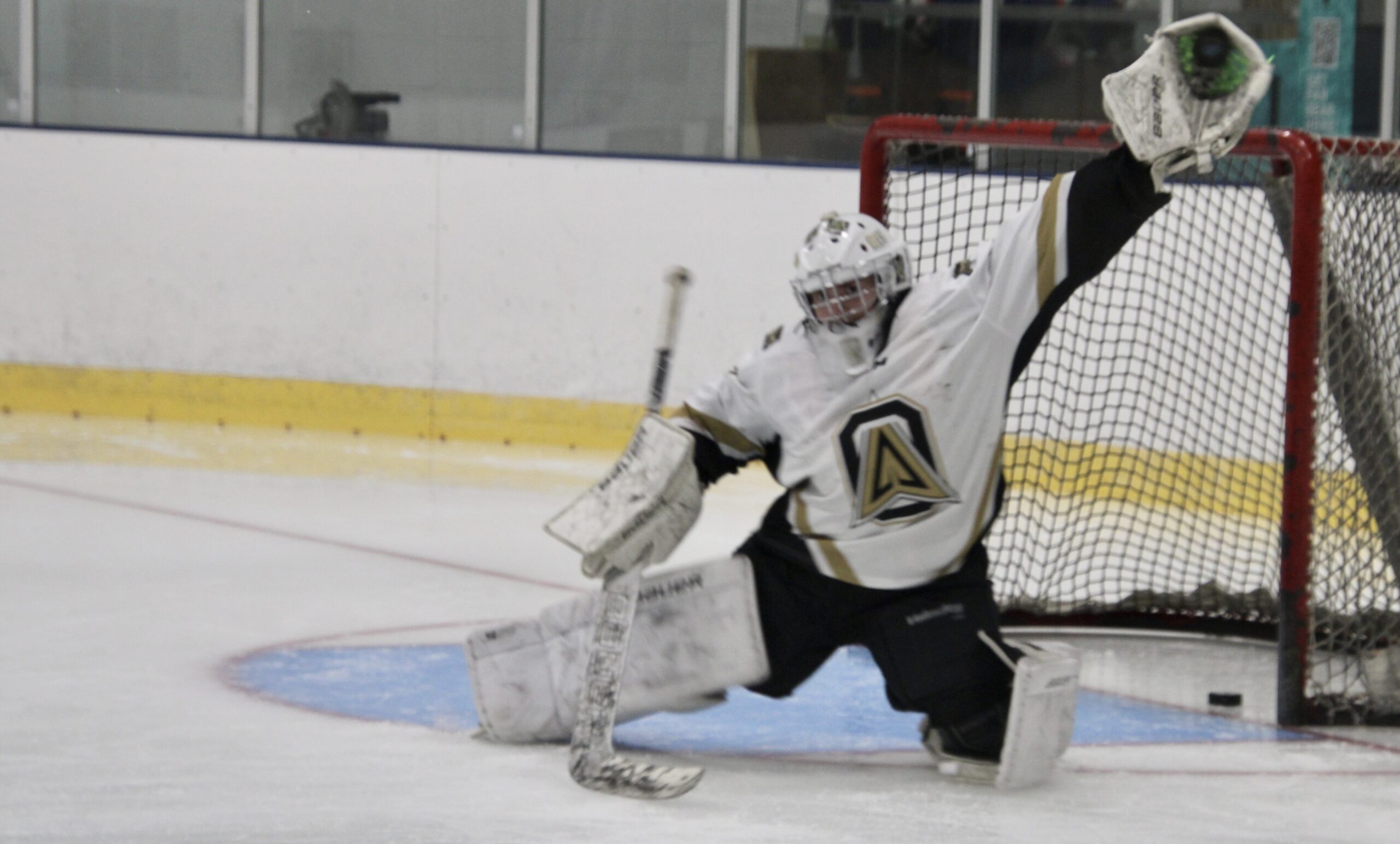 (Rick Miller - Olean Star) Goalie Dominic Cavallo of Allegany snags a puck Monday during the first skate and shoot of the 2024-25 season at the William O. Smith Recreation Center.
