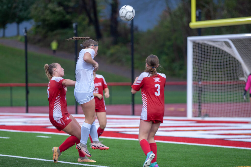 A-Portville-Player-heads-the-ball-while-being-defended-by-Randolphs-3-Kyler-Patterson-Photo-Bob-Crandall-1-scaled.jpg