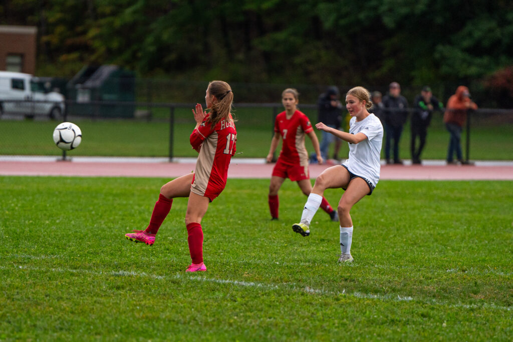 Photo by Hunter O. Lyle  Cait Kellogg shoots and scores goal number six for Allegany-Limestone during their shutout victory over Olean.