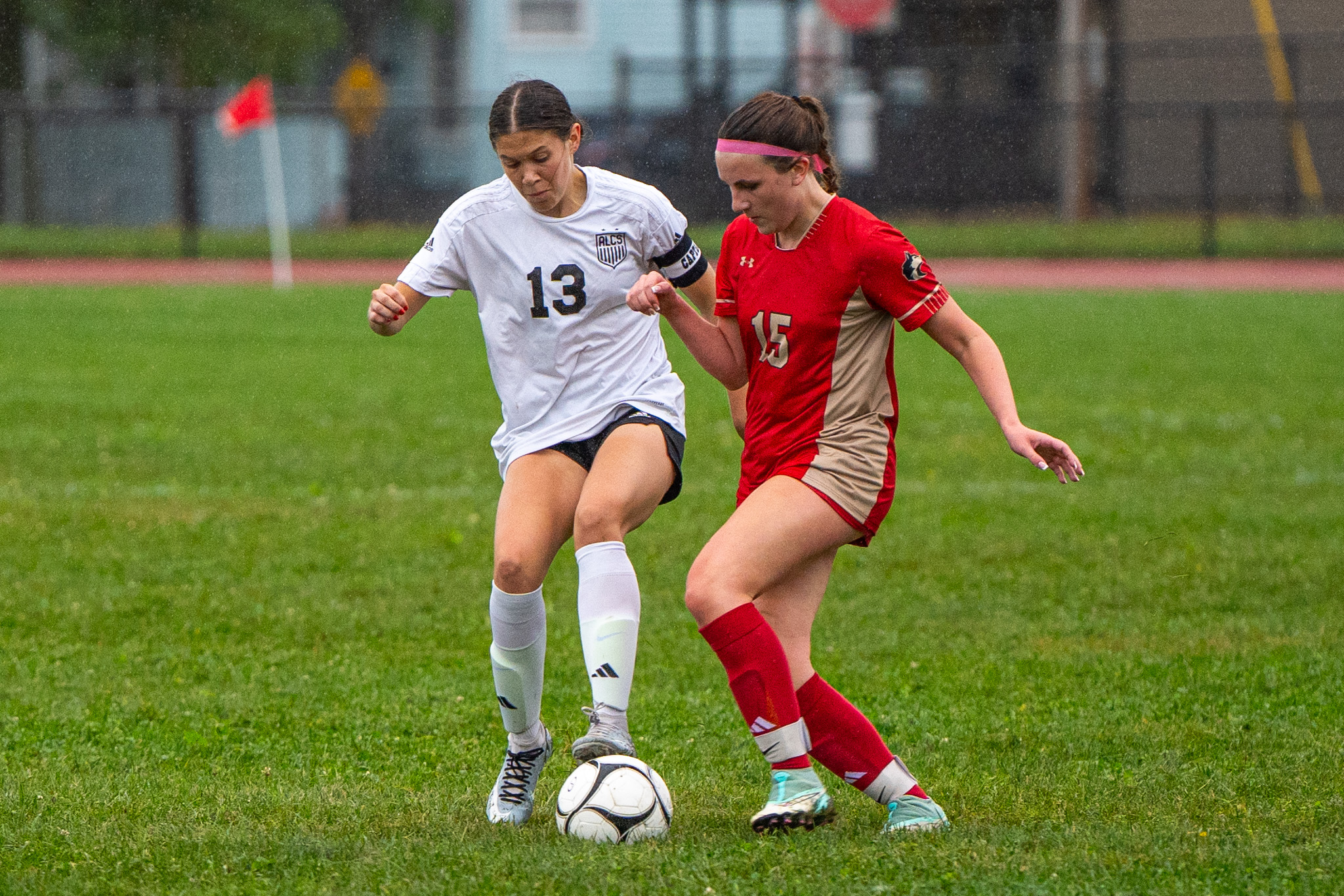 Photo by Hunter O. Lyle Allegany-Limestone’s Addie Fisher and Olean’s Chloe Stitt battle for possession during the Lady Gators’ 8-0 win over the Lady Huskies on Tuesday.