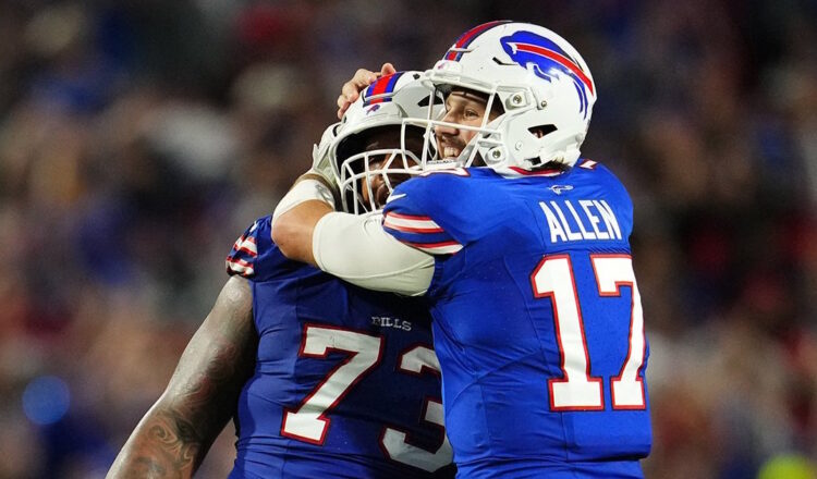 Photo: Josh Allen, who said “these guys aren’t worried about stats or touchdowns … they love each other and love being part of this,” hugs offensive lineman Dion Dawkins after a touchdown put the Bills up, 34-3 just before halftime. Photo courtesy Buffalo Bills.