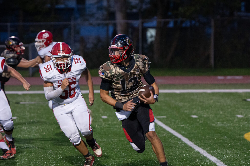 Photo by Hunter O. Lyle Bradford quarterback Talan Reese scrambles out of the pocket during the Owls’ 56-7 loss to Punxsutawney on Friday.