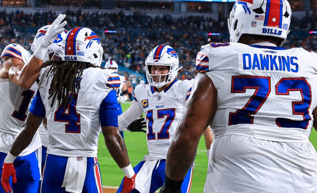 Josh Allen joins teammates after a James Cook touchdown. Photo by James Gilbert/Buffalo Bills