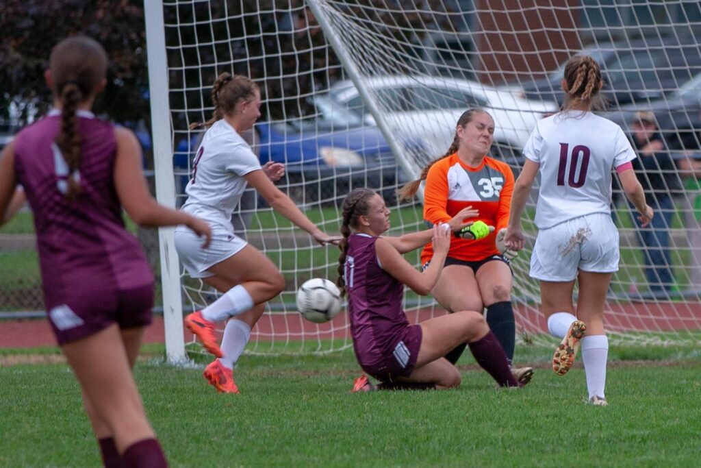Ellicottvilles-Goalkeeper-Courtney-Marsh-and-Allie-Bray-17-collide-as-Marsh-stops-a-Portville-shot-on-goal