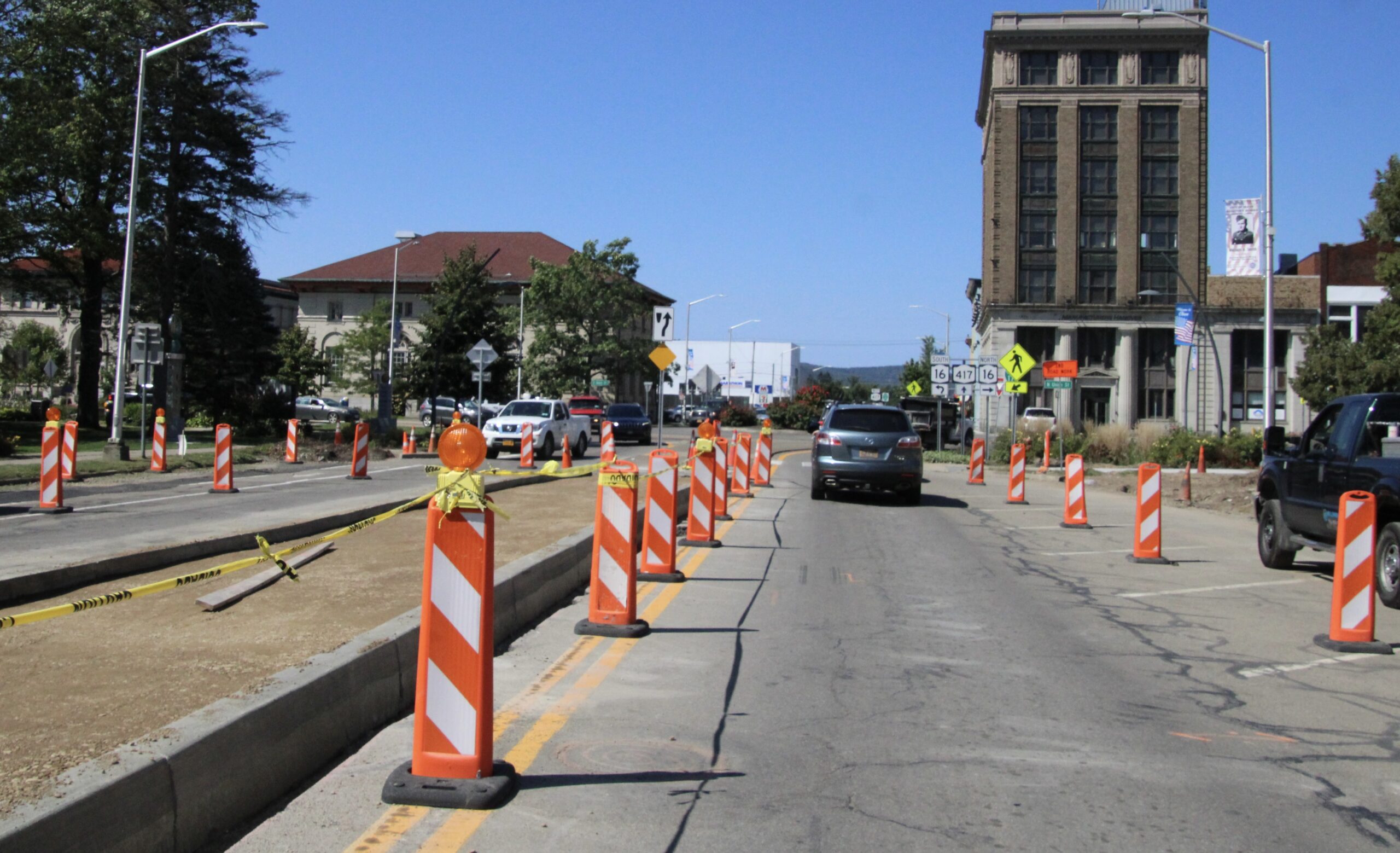 (Rick Miller/Olean Star) Walkable Olean III construction continued Wednesday on East State Street in front of the Olean Municipal Building. Millennium Construction crews built curbs around the medians which will continue the floral themes in the downtown medians.