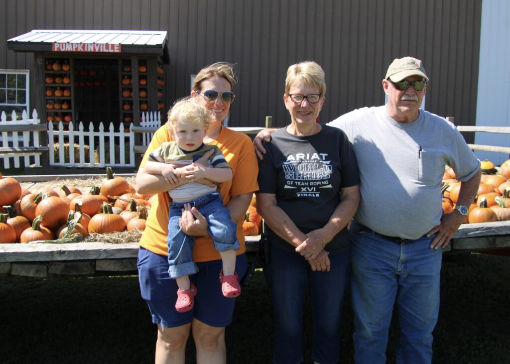 (Rick Miller/Olean Star) The Pawlowski family are readying Pumpkinville for its fall opening Saturday. From left are Lisa Pawlowski with her son Porter Spako, and her parents Diane and Dan Pawlowski.