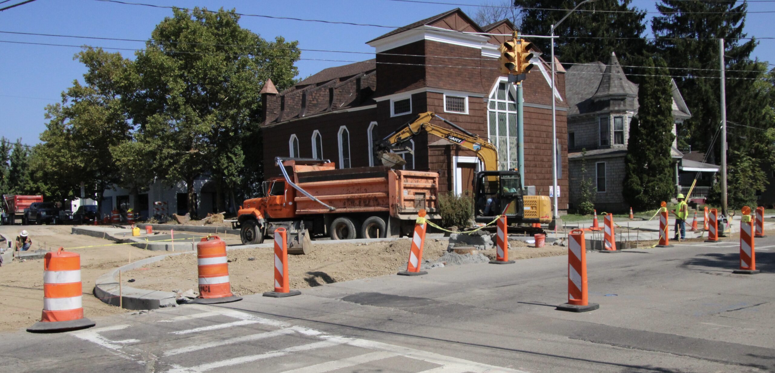 (Rick Miller/Olean Star) Millennium Construction continued to work Monday on the north end of the Walkable Olean III mini-roundabout at East State and Barry streets.