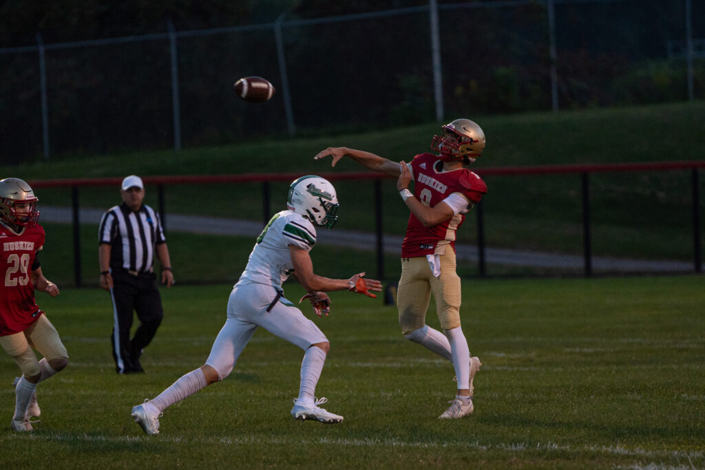 Photo by Hunter O. Lyle Olean’s Austin Miles wraps up Lewiston Porter’s Jackson Courts during the Huskies’ 29-7 win on Friday.