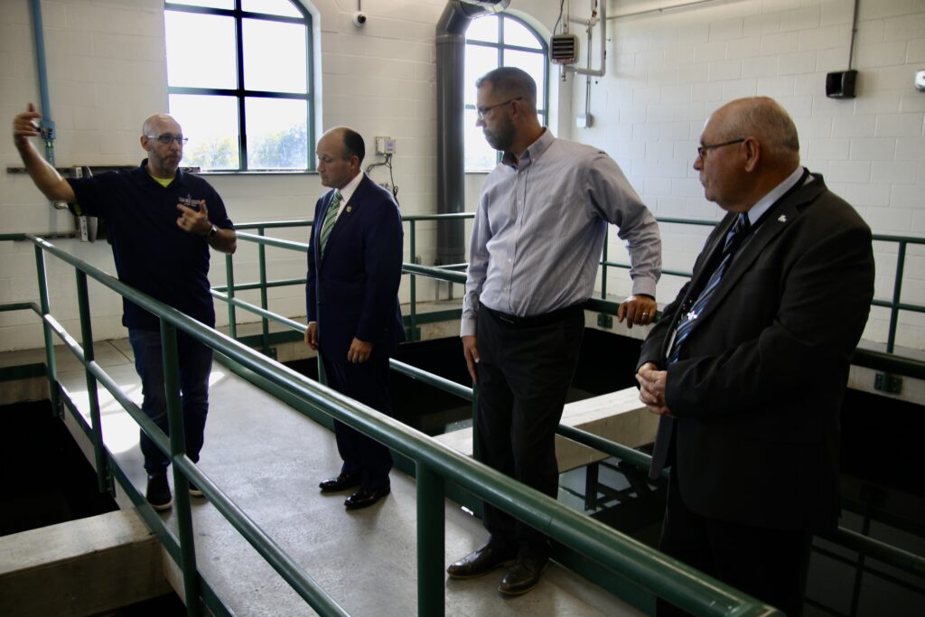 (RickMIller/Olean Star) Olean Water Filtration Plant operator Bryan Mansfield (left) explains the plant's workings to Rep. Nick Langworthy (third from left) during a tour of the plant with Mator Bill Aiello (right) and Water and Sewer Department Director Brad Camp.