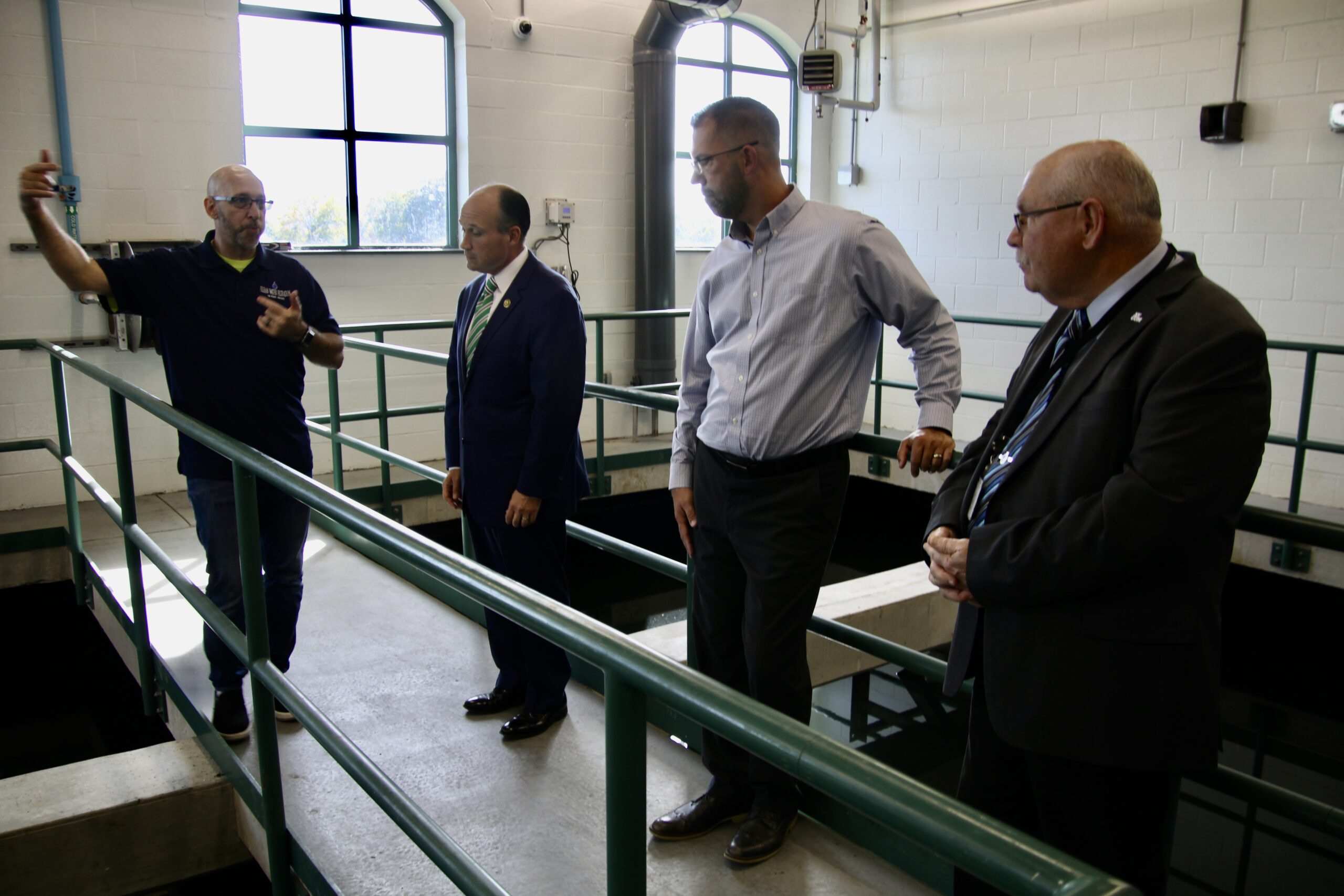 (RickMIller/Olean Star) Olean Water Filtration Plant operator Bryan Mansfield (left) explains the plant's workings to Rep. Nick Langworthy (third from left) during a tour of the plant with Mator Bill Aiello (right) and Water and Sewer Department Director Brad Camp.