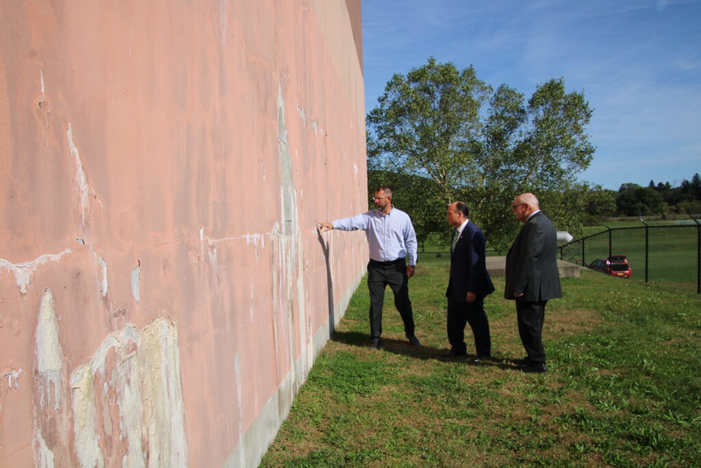 
(Rick MIller/Olean Star)  Olean Water and Sewer Department Director Brad Camp (left) shows signs of leaks in the water treatment plant wall to Rep. Nick Langworthy (center) and Mayor Bill Aiello.