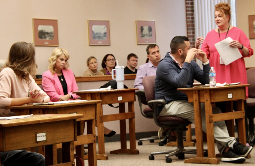(Rick Miller/Olean Star) Cattaraugus County Legislator Ginger Schroder (standing at right), spoke in support of amending requirements in the county's 2021 Animal Abusers Registry. Schroder and several other legislators and county officials wore pink to promote Breast Cancer Awareness Month.