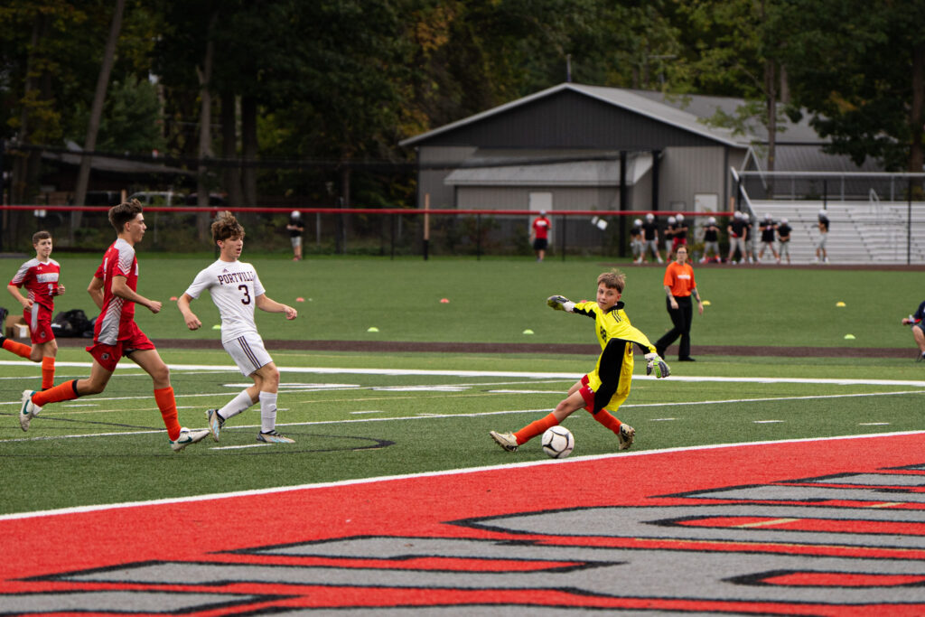Photo by Hunter O. Lyle  Portville’s Braedon Carter sends a shot past the War Wolves’ goaltender during the Panthers’ 10-1 win on Monday.