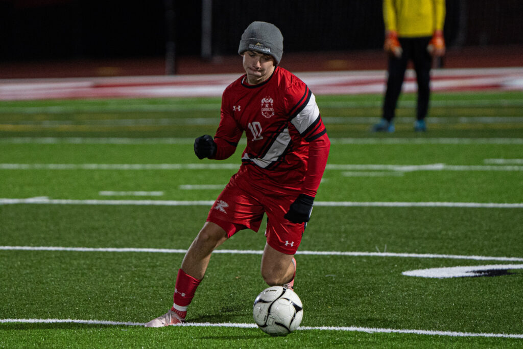 Photo by Hunter O. Lyle  Griffin Nelson fights for possession for the Cardinals during their loss to Portville on Wednesday.  
