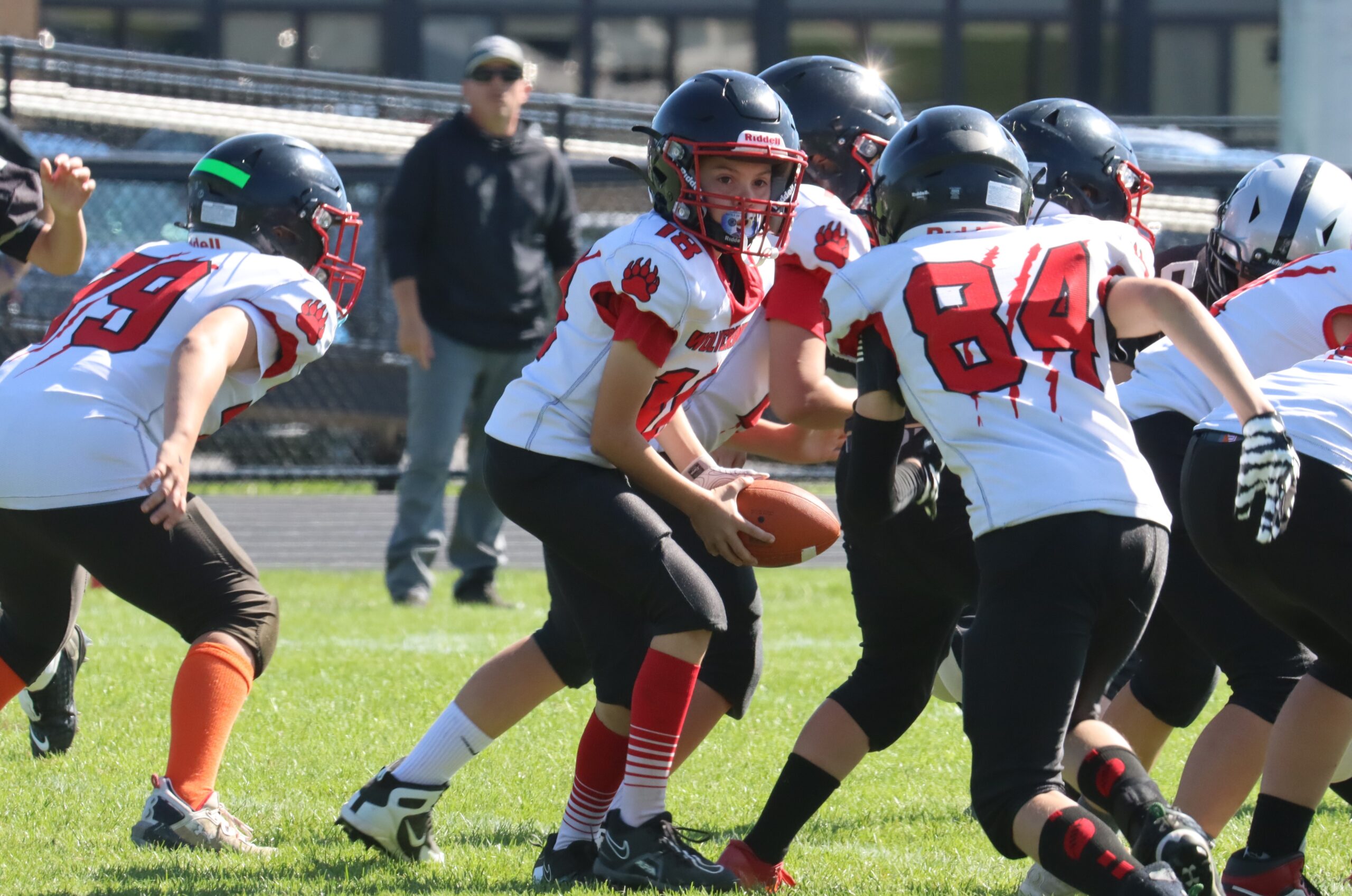 Photo-Char-Stone-Wolverines-QB-Grant-Bell-18-hands-off-to-Joe-TD-Welsch-84