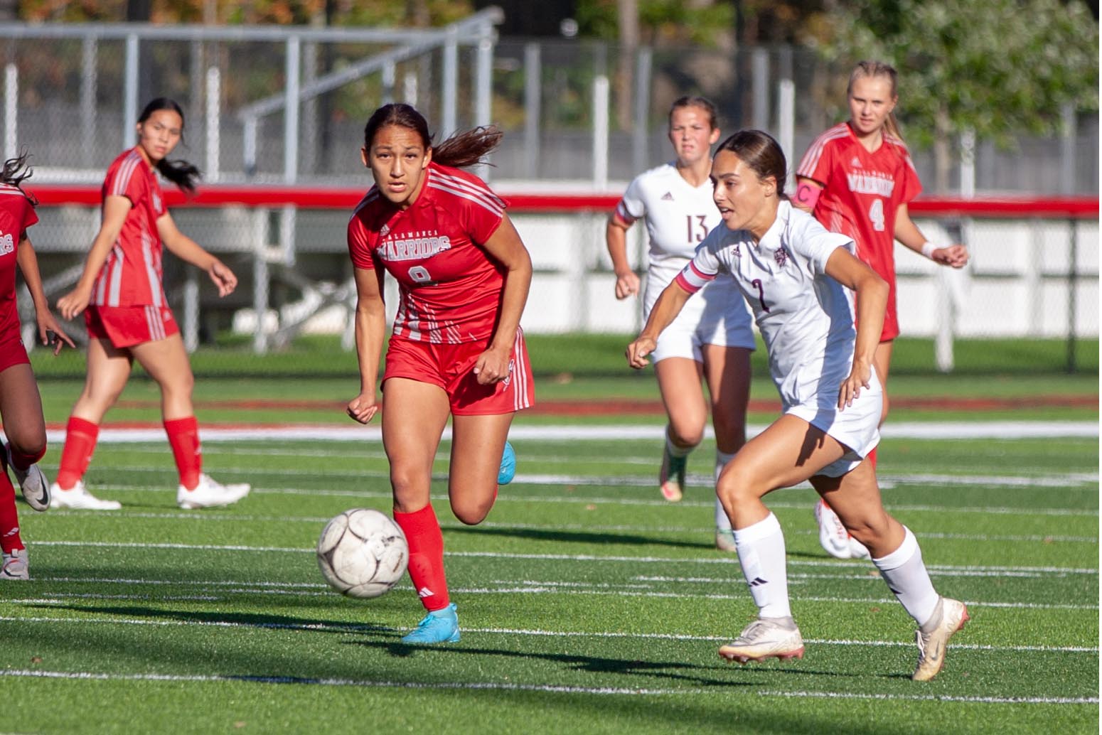 Salamancas-Leilene-McComber-and-Ellicottville-Addie-John-race-for-the-ball-Photo-Bob-Crandall
