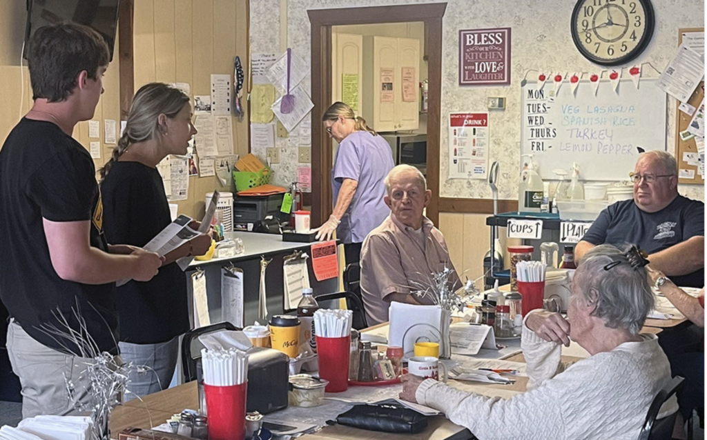(Photo provided) St. Bonaventure Mother Cabrini interns talk with senior citizens at the Senior Wellness & Nutrition Site in Delevan about fall prevention.
