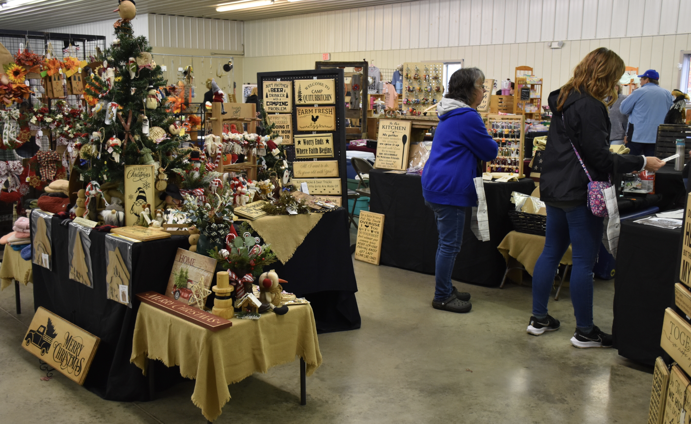 (Photo provided) Visitors to last year's W.I.L.M.A. Wooly Bear Weekend at the Cattaraugus County Fairgrounds in Little Valley look at locally-made crafts for sale from local artisans and manufacturers.