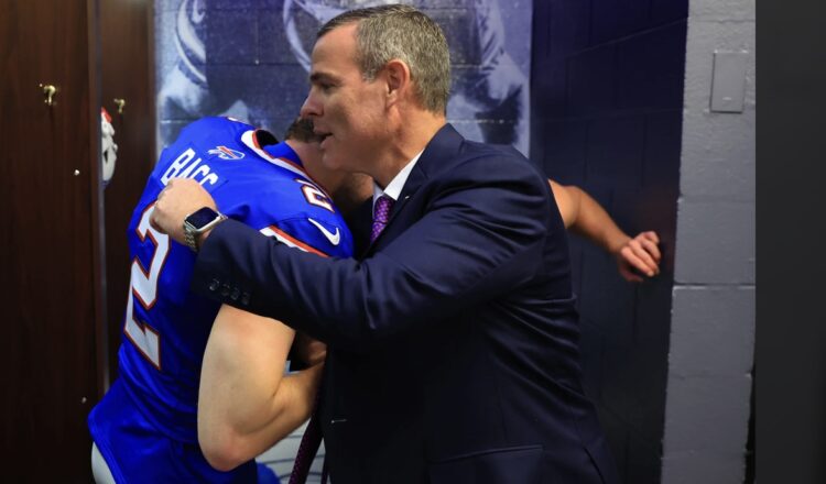 Buffalo Bills’ General Manager Brandon Beane hugs Bills kicker Tyler Bass in the lockerroom after the victory on Sunday against Miami. After missing an extra point, the was how Lucas Havrisik was on the practice squad. After the game, Chuck Pollock points out, Bass is 18-of-21 on field goals this season. Bill Wippert photo/Buffalo Bills