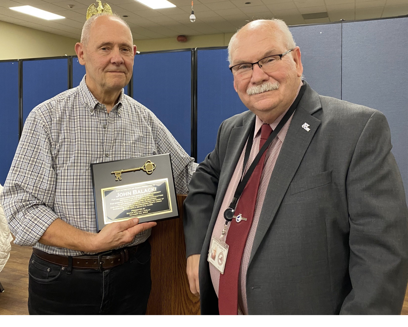 (Photo Provided) John Balacki of the Olean Downtown Beautification Group (left) was presented a plaque for Volunteer of the Year by Olean Mayor Bill Aiello recently.