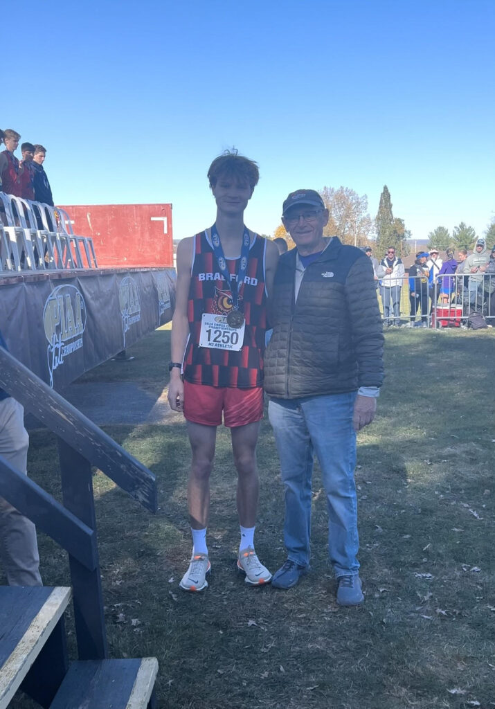Bradford's Brayden Frair and cross country head coach Tom Tessena pose at the Pennsylvania Cross Country Championship Meet. At the meet, Frair finished in 16th. | Photo provided