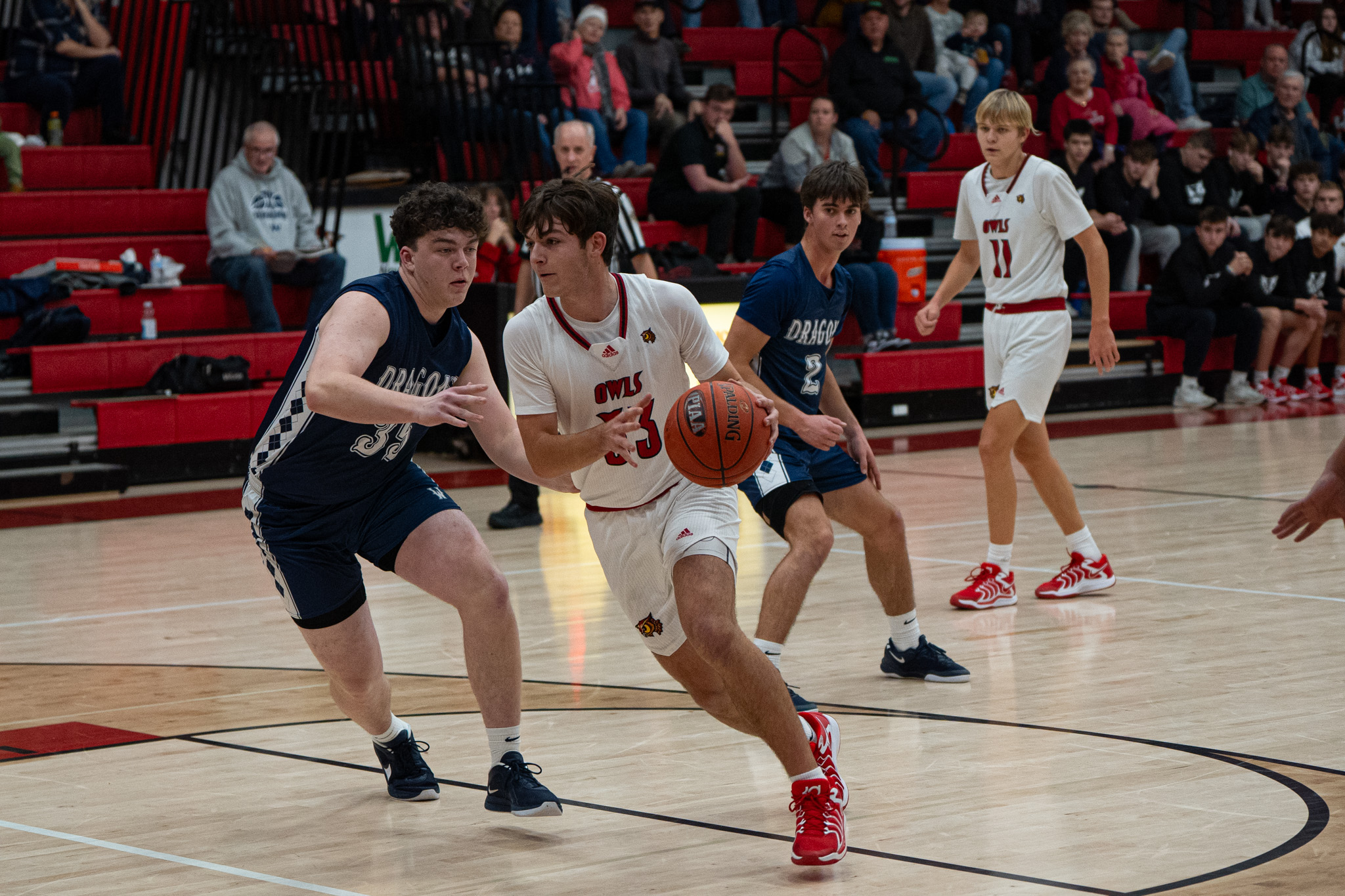 Danny Marasco charges towards the rim during the Owls’ home-opening loss to Warren on Monday. Marasco finished with a team-high 14 points. | Photo by Hunter O. Lyle