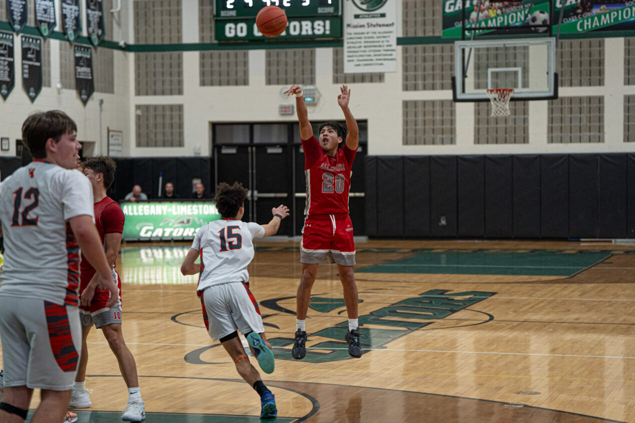 Salamanca's Avery Brown takes a contested jumper during the Warriors' 66-65 loss to Wellsville. Brown scored a team-high 20 points, earning the Player of the Game award. | Photo by Hunter O. Lyle