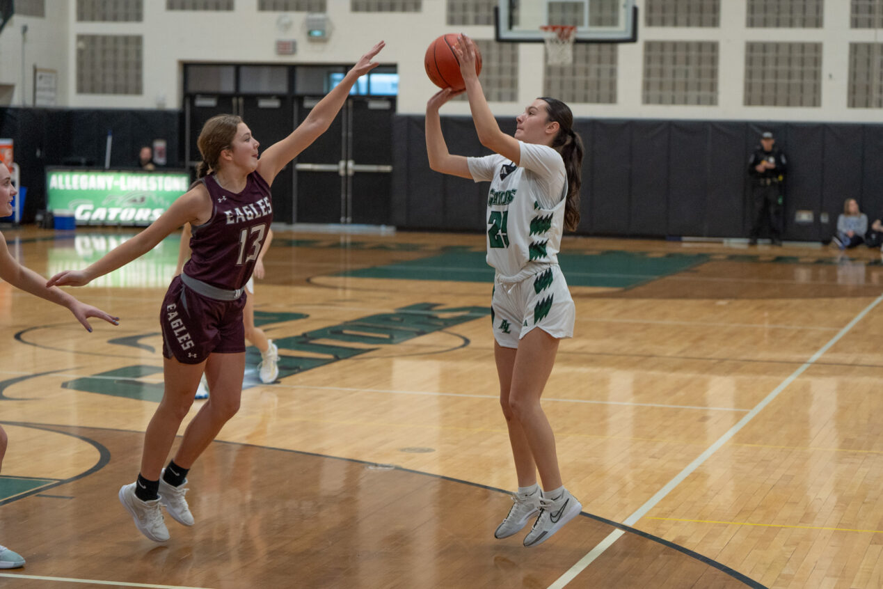 Emerson Ortega shoots a contested jumper during the Lady Gators' one-point loss to Ellicottville. | Photo by Hunter O. Lyle