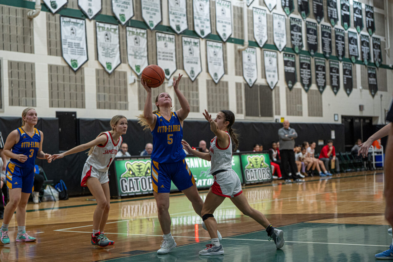 Carrie Drummond fights through traffic to get to the rim during O-E's win over Jamestown on Saturday. | Photo by Hunter O. Lyle