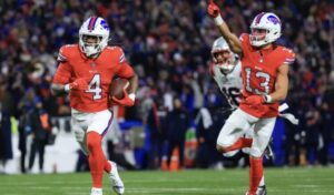 Cutline: James Cook races to the end zone with an escort form Mac Hollins. Bill Wippert/Buffalo Bills photo
