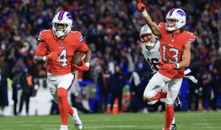 Cutline: James Cook races to the end zone with an escort form Mac Hollins. Bill Wippert/Buffalo Bills photo