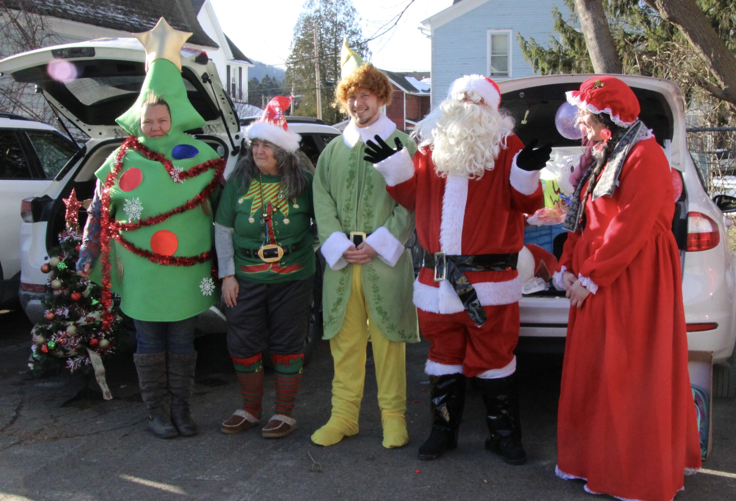 (Rick Miller/Olean Star) Connecting Communities in Action employees and volunteers dressed up for Friday's Santa's Carnival at CCA on Jefferson Street in Salamanca.
