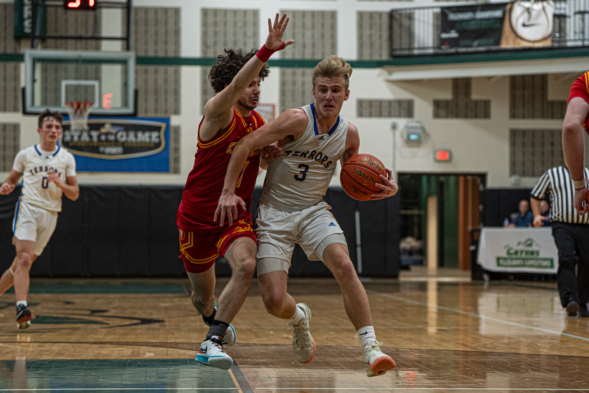Otto-Eldred's Landon Francis pushes through contact on his way to the rim during the Terrors' 64-43 win over Olean. In the third quarter, Francis' eight unanswered points helped spark the Terrors' comeback. | Photo by Hunter O. Lyle