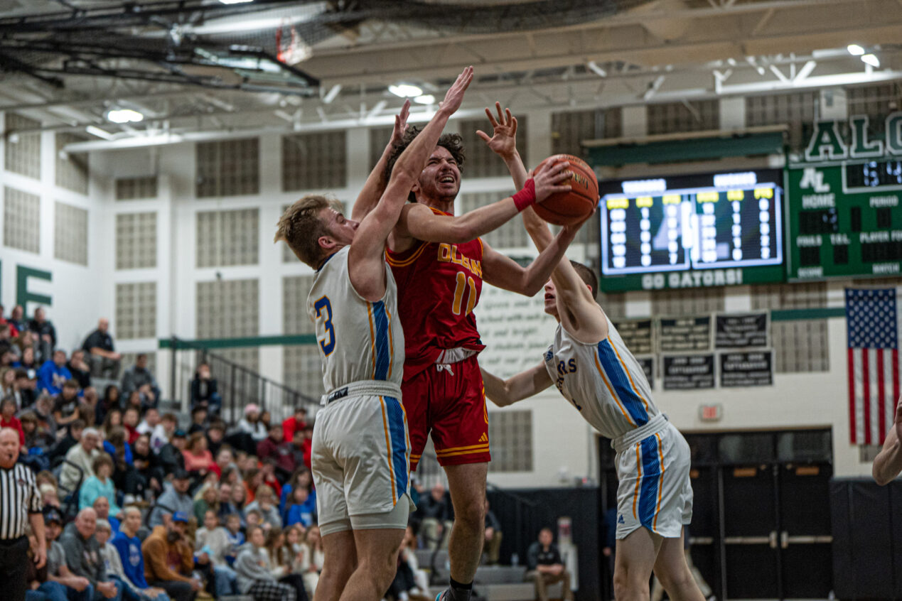 Olean's Luca Quinn gets smothered by two Terror defenders during the Huskies' loss in the opening day of the Joe DeCerbo Memorial Showcase. | Photo by Hunter O. Lyle