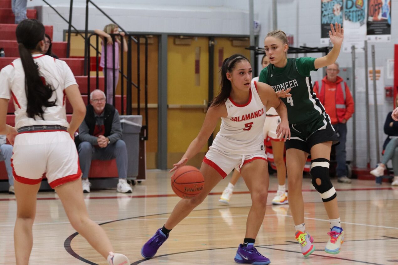 Salamanca’s Leilene McComber (5) looks to back down a Pioneer defender into the paint. in the Warriors win over the Panthers on Dec. 12. | File photo courtesy of Salamanca Warrior Athletics