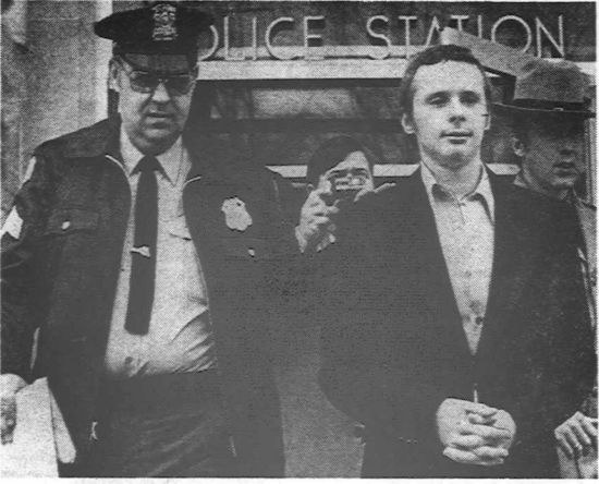 (Courier Express photo) Accused sniper Anthony Barbaro is led out of Olean Police Headquarters in January 1975 after his arraignment on three counts of second-degree murder. Three people died and 11 were injured in the sniping from Olean High School on the afternoon of Dec. 30, 1974.